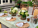 Wicker basket hurricane styled as a natural table centerpiece