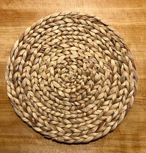 Woven water hyacinth placemats adding natural texture to a table setting