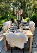 Antiqued iron 13-taper candelabra styled as a dramatic table centerpiece