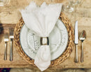Classic white linen napkins styled with tabletop accents