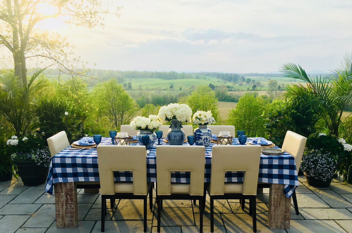 Outdoor blue-and-white table styled with the You Blue Me Away kit without vases
