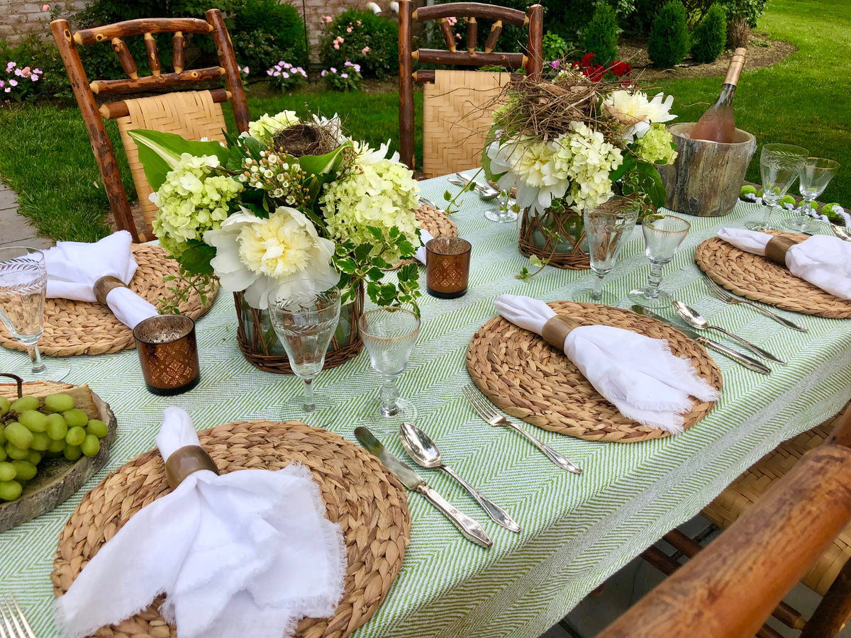 Water hyacinth placemats layered under dinnerware