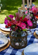 Wicker basket vase styled with flowers on a dining table
