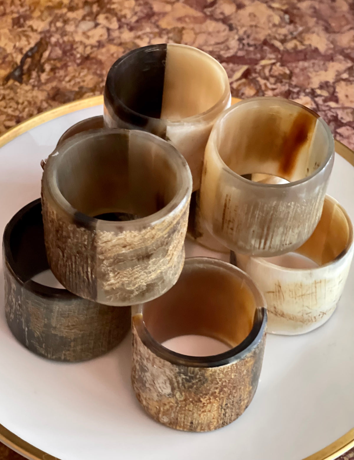 Set of eight natural horn napkin rings for an elegant layered table