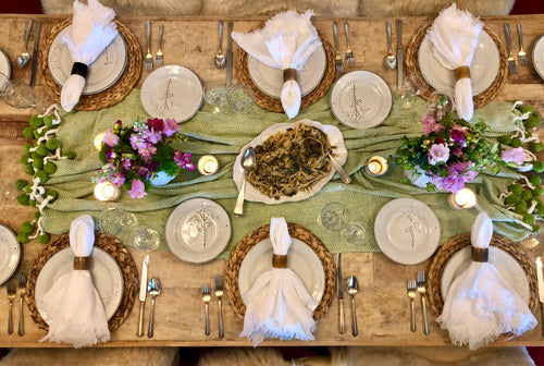 White stonewashed linen napkins folded for an elegant place setting