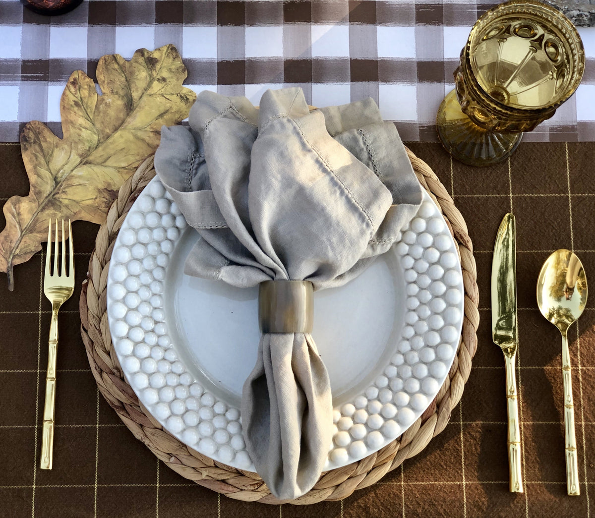 Natural horn napkin ring adding organic texture to a place setting
