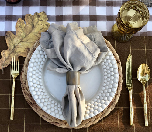 Natural horn napkin ring adding organic texture to a place setting